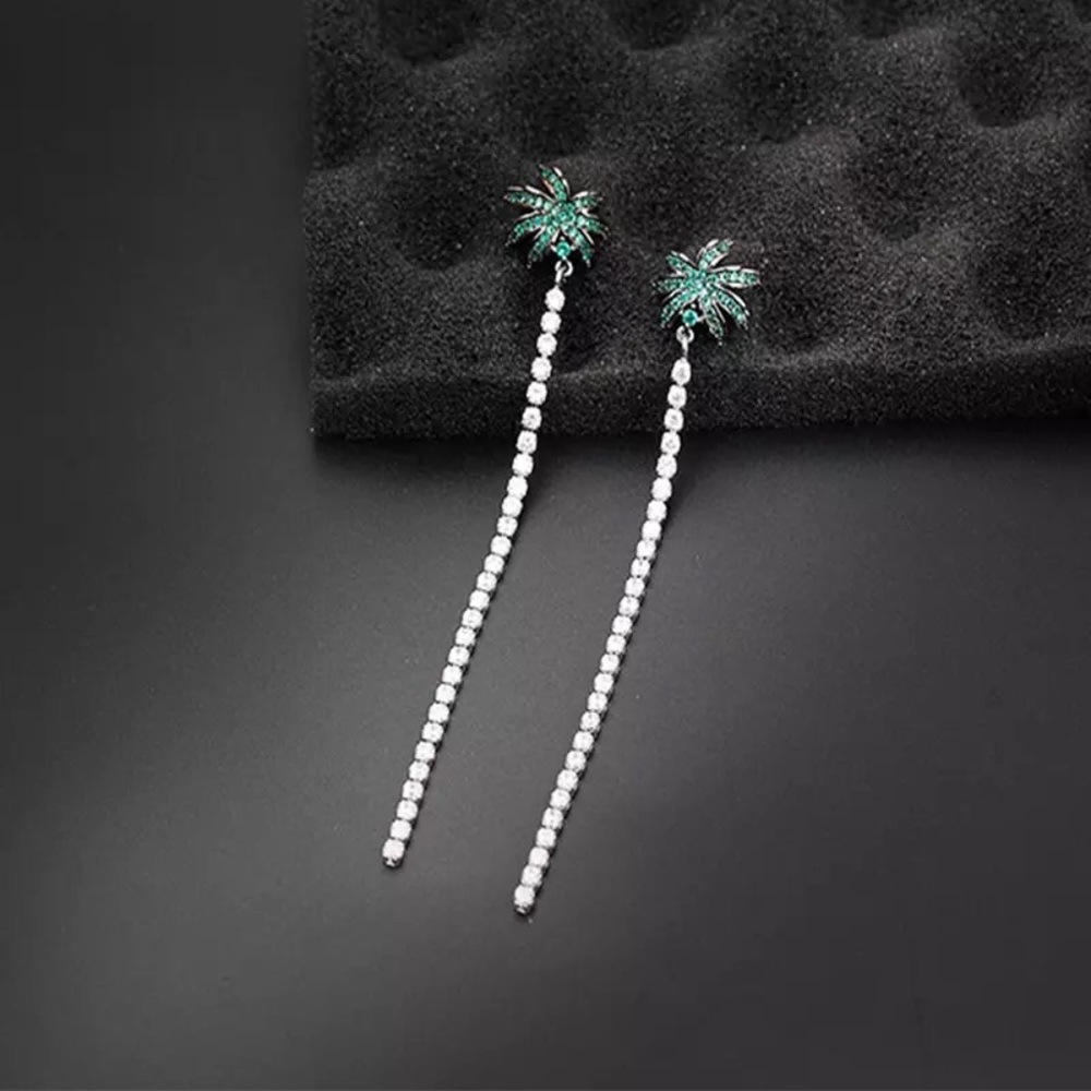 palm tree style woman’s earring shining